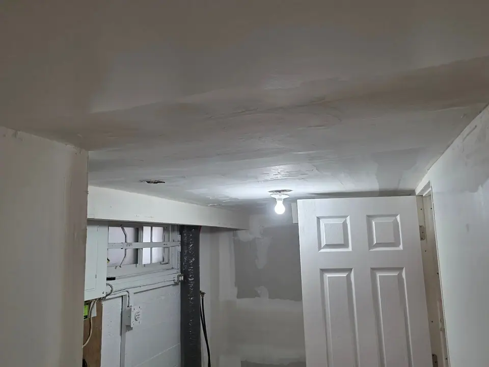 Basement ceiling: ductwork boxed in, bulkheads and drywall: Zenith job-site photo