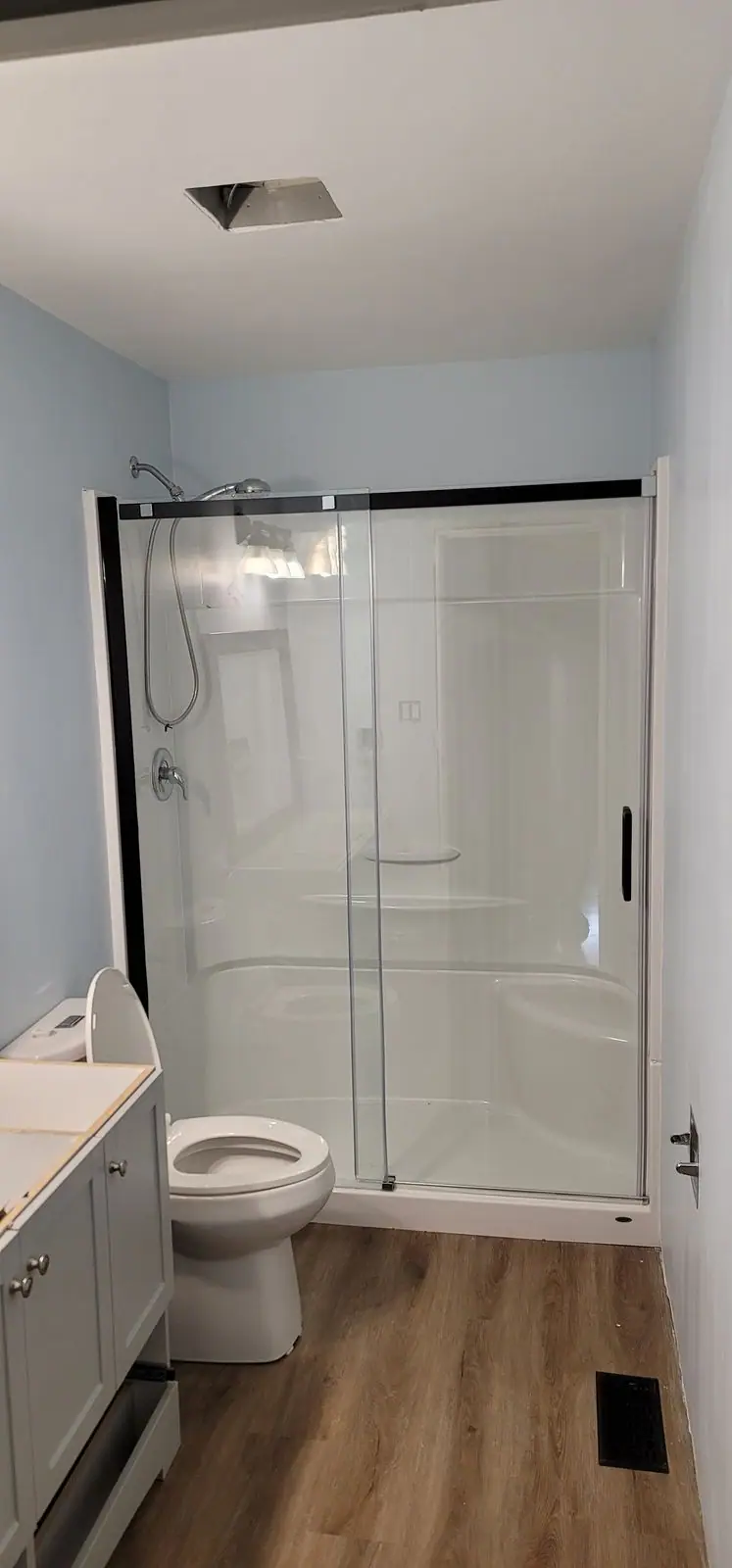 Bathroom with a full-width sliding glass shower, photo 5 of 5 (finished)