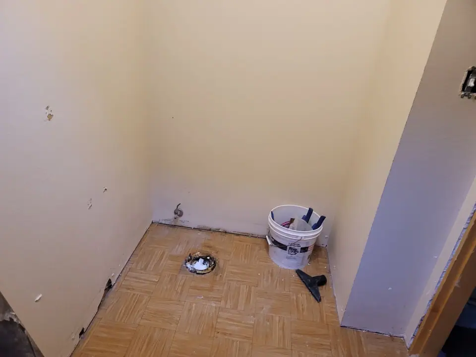 Bathroom rebuild with a skylight well and wood vanity, photo 5 of 11 (demolition)