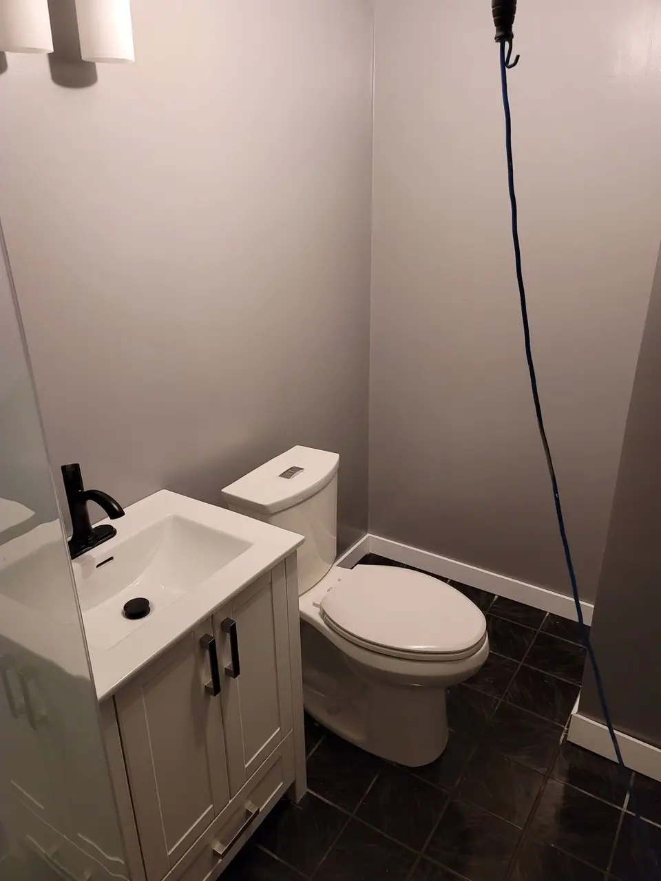 Basement bathroom with a corner glass shower, photo 6 of 9 (finished)