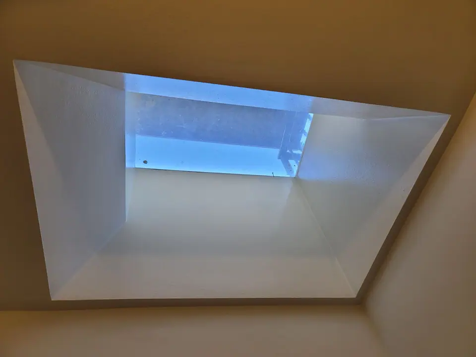 Bathroom rebuild with a skylight well and wood vanity, photo 9 of 11 (finished)