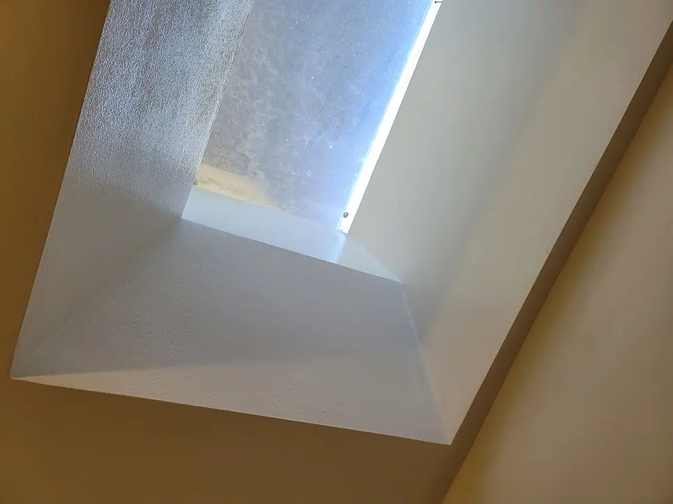 Bathroom rebuild with a skylight well and wood vanity, photo 10 of 11 (finished)