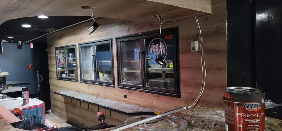 Commercial interior: curved wood-look bulkhead and service wall, photo 7 of 15