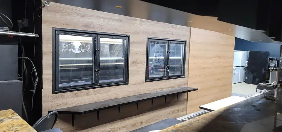 Commercial interior: curved wood-look bulkhead and service wall, photo 12 of 15