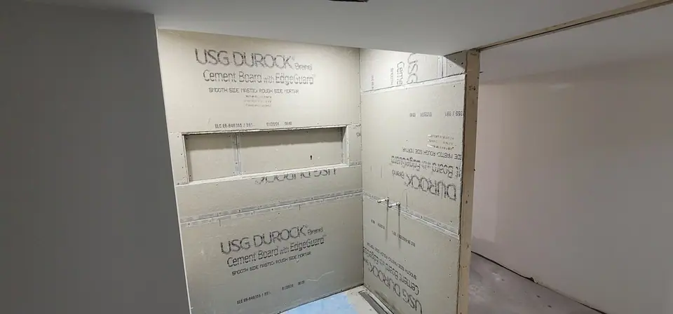 Basement suite bathroom: walk-in shower and stacked laundry, photo 13 of 30 (in progress)