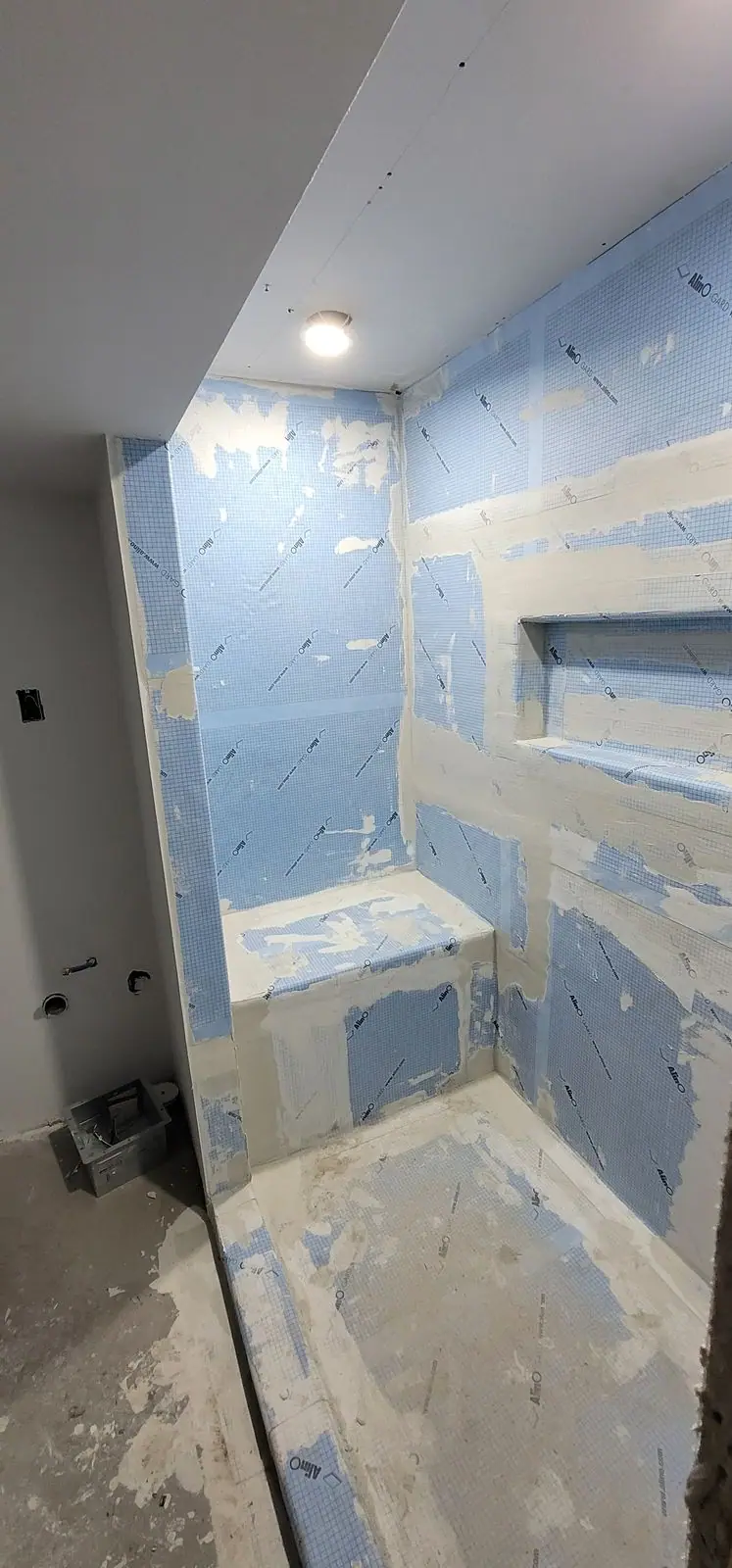 Basement suite bathroom: walk-in shower and stacked laundry, photo 14 of 30 (in progress)