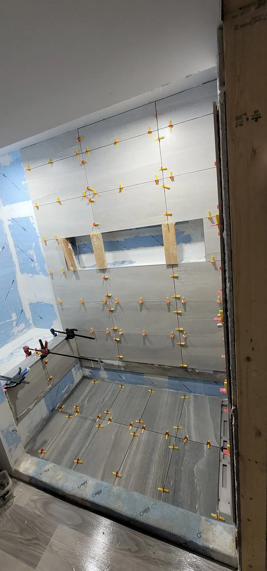Basement suite bathroom: walk-in shower and stacked laundry, photo 20 of 30 (in progress)
