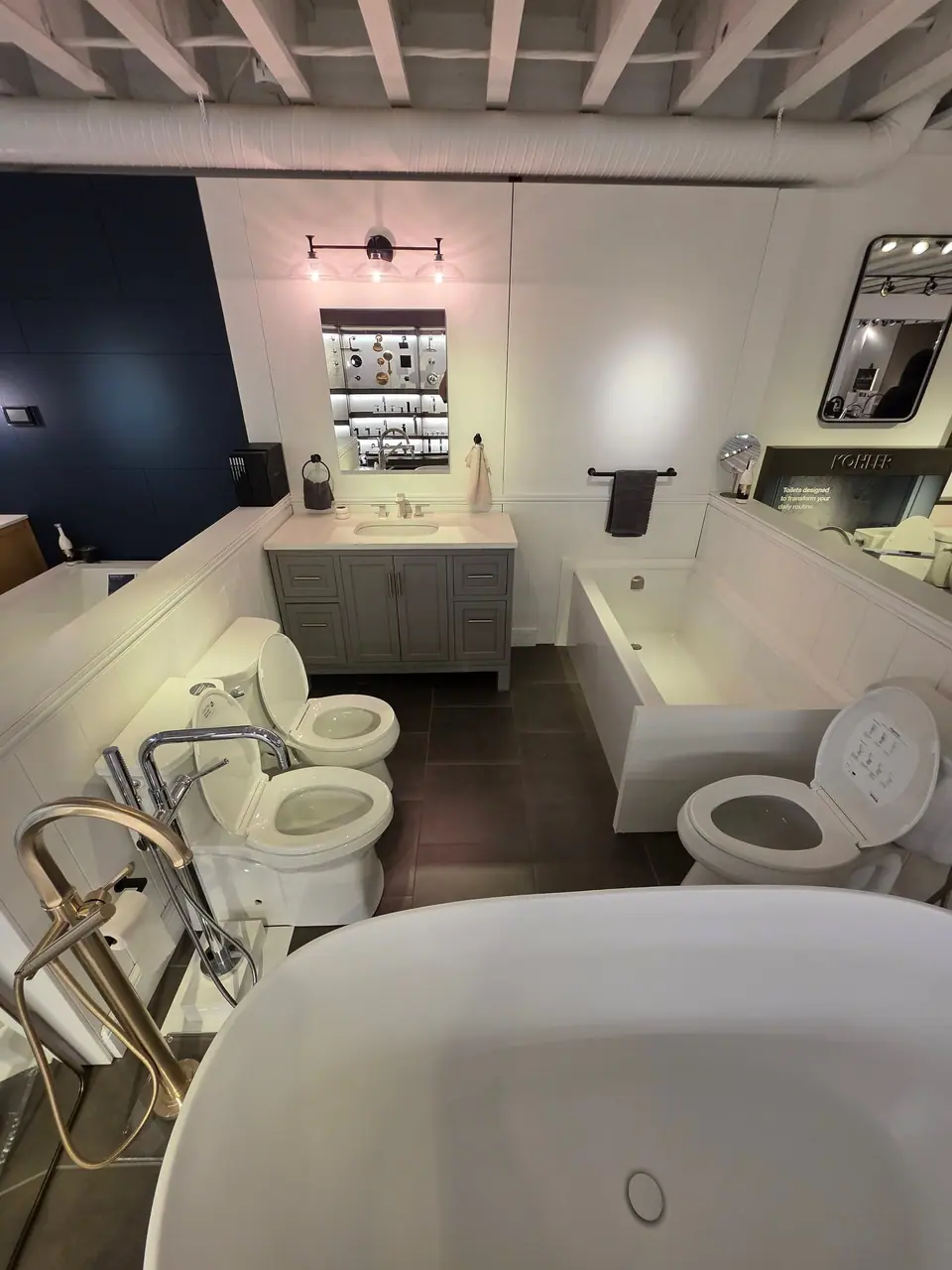 Bathing in a KOHLER fixture showroom