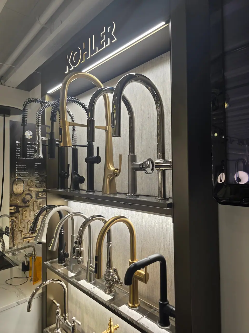 Kitchen sinks and faucets in a KOHLER fixture showroom