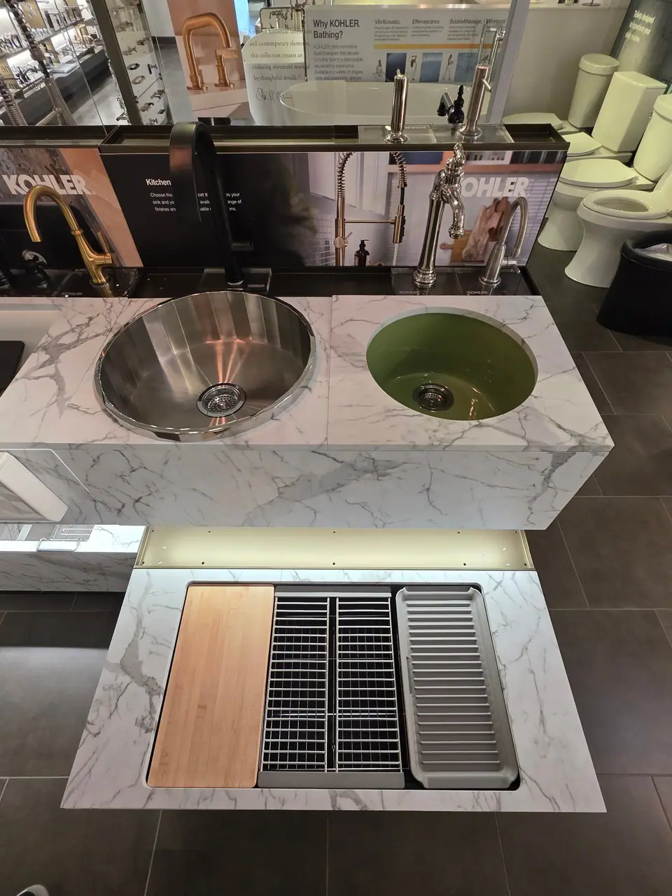 Kitchen sinks and faucets in a KOHLER fixture showroom