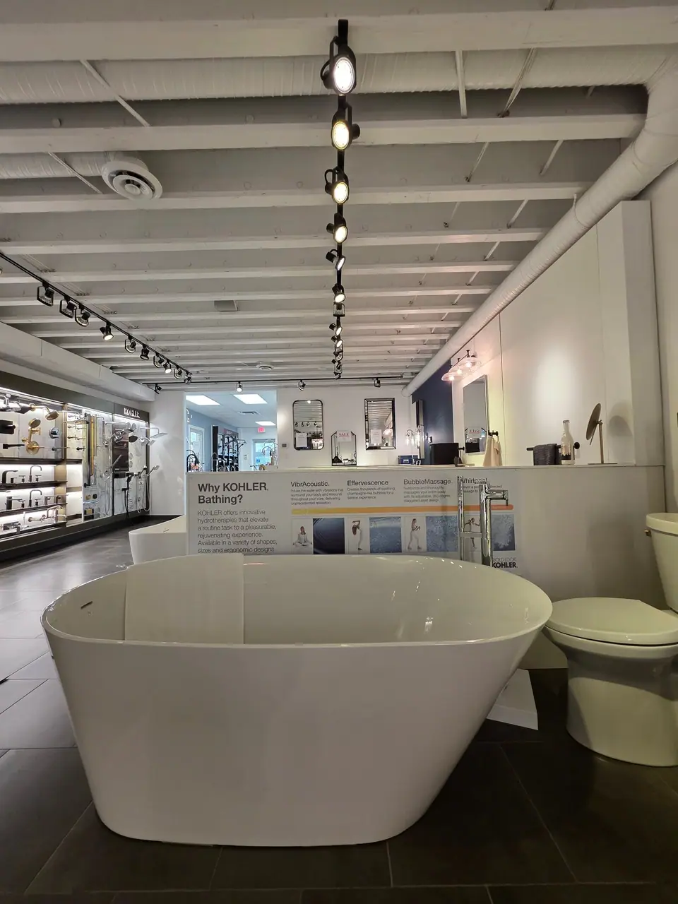 Bathing in a KOHLER fixture showroom
