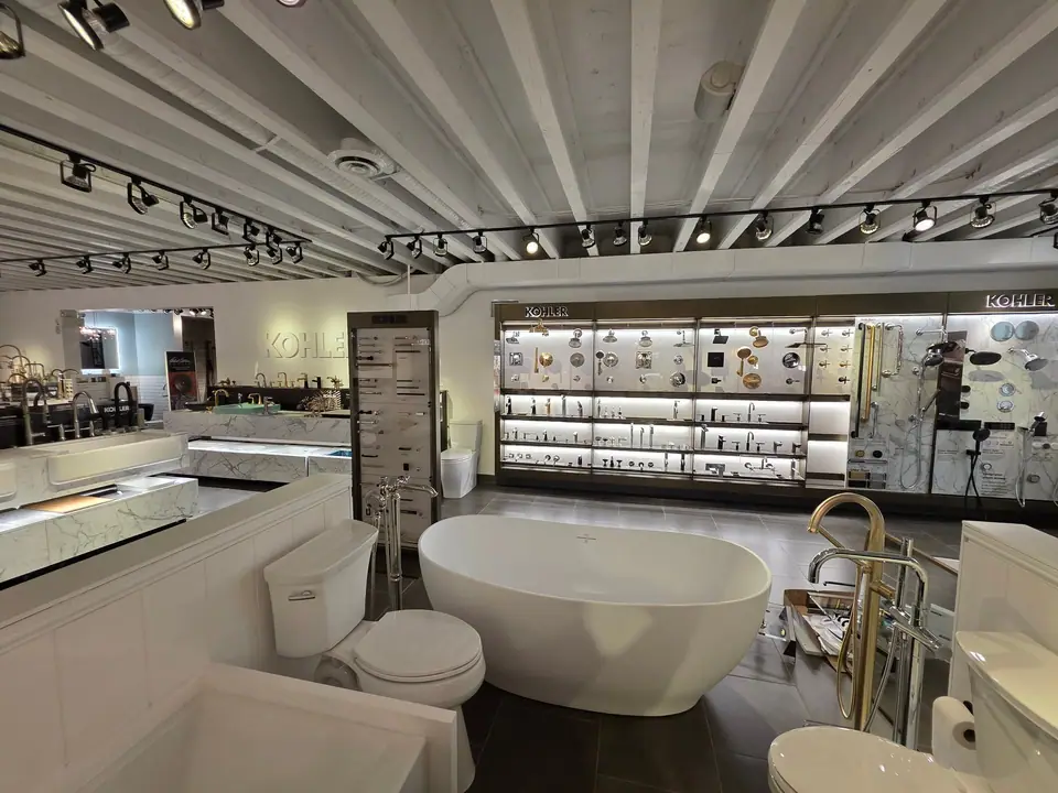 Bathing in a KOHLER fixture showroom